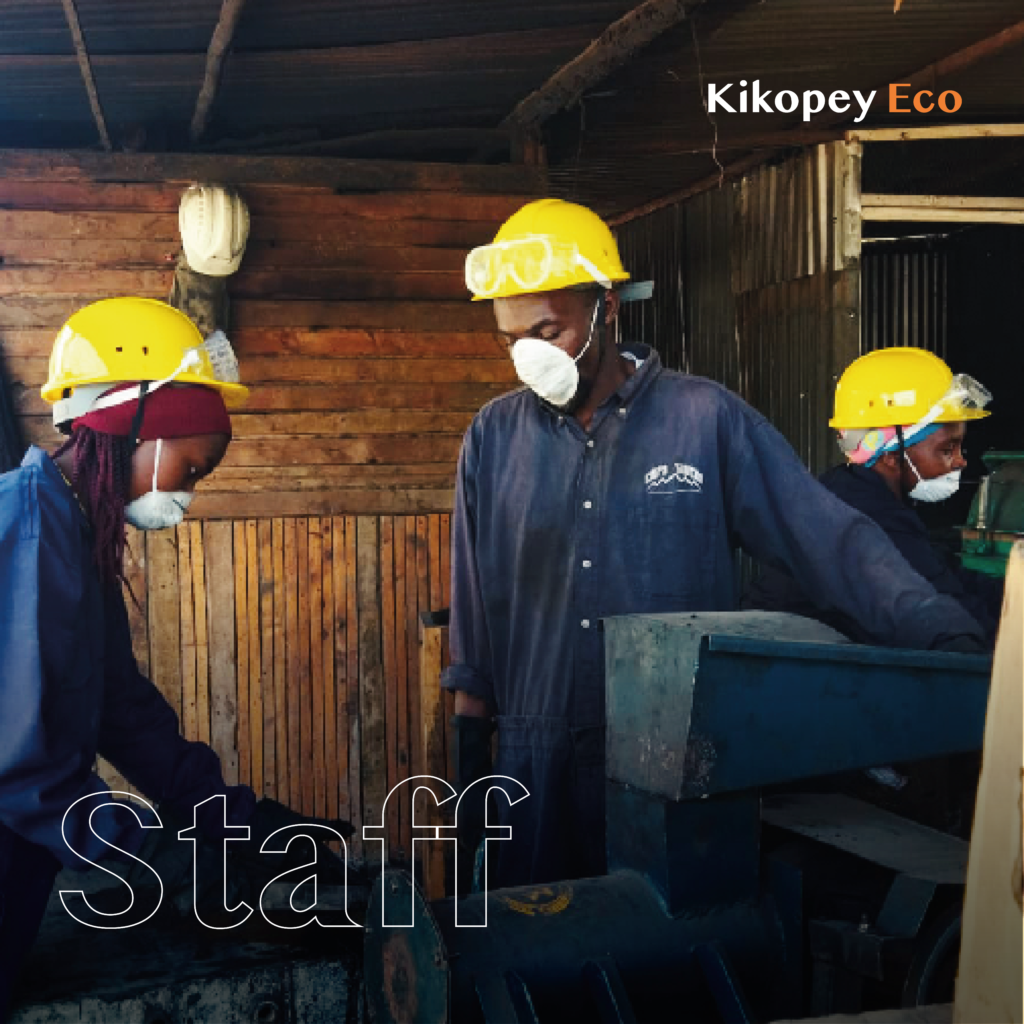 Kikopey staff producing briquettes